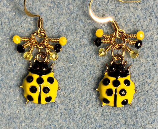 Yellow and black enamel ladybug charm earrings adorned with tiny dangling yellow and black Chinese crystal beads.