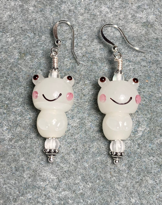 White lamp work silly frog bead earrings adorned with matte clear Czech glass beads.