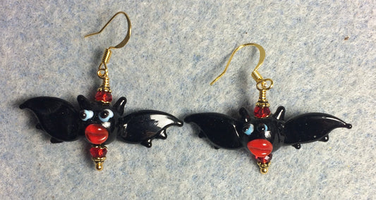 Black and red lamp work bat bead earrings adorned with red Chinese crystal beads.