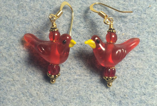 Translucent red lamp work songbird bead earrings adorned with red Czech glass beads.