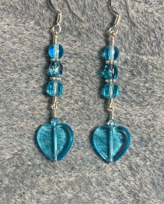 Translucent turquoise Czech glass heart bead earrings adorned with turquoise Czech glass beads.