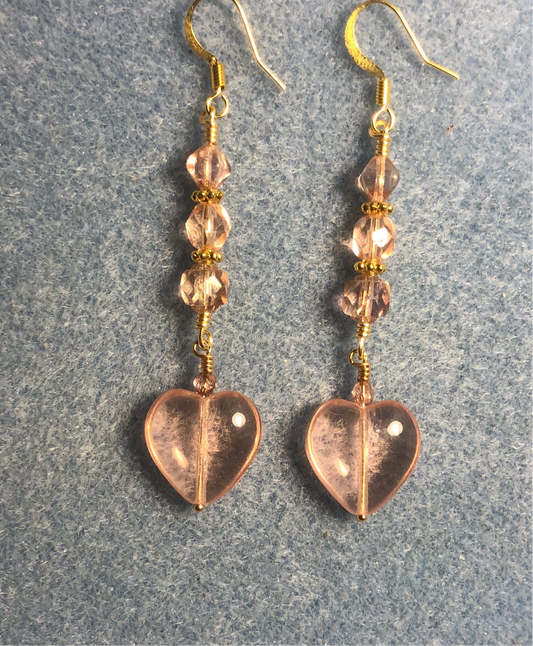 Translucent pink Czech glass heart bead earrings adorned with light pink Czech glass beads.