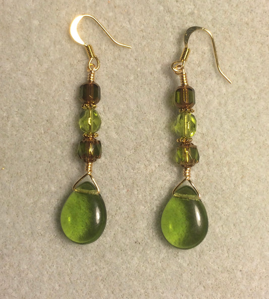 Translucent olive green Czech glass pear drop bead earrings adorned with olive green Czech glass beads.