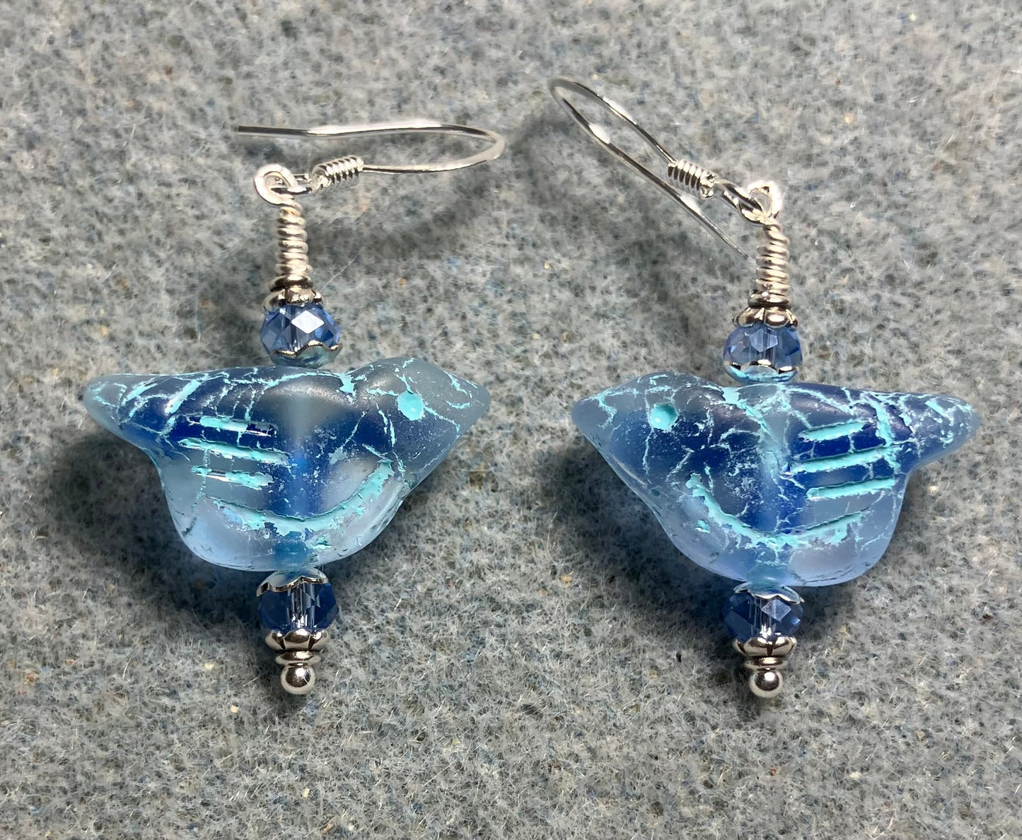 Light blue (with light blue wash) Czech glass bird bead earrings adorned with light blue Chinese crystal beads.