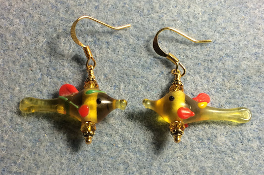 Small translucent amber and orange lamp work fish bead earrings adorned with amber Chinese crystal beads.