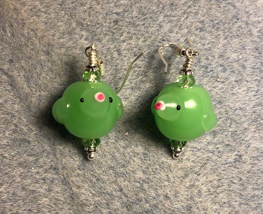 Light green lamp work bird bead earrings adorned with light green Chinese crystal beads.