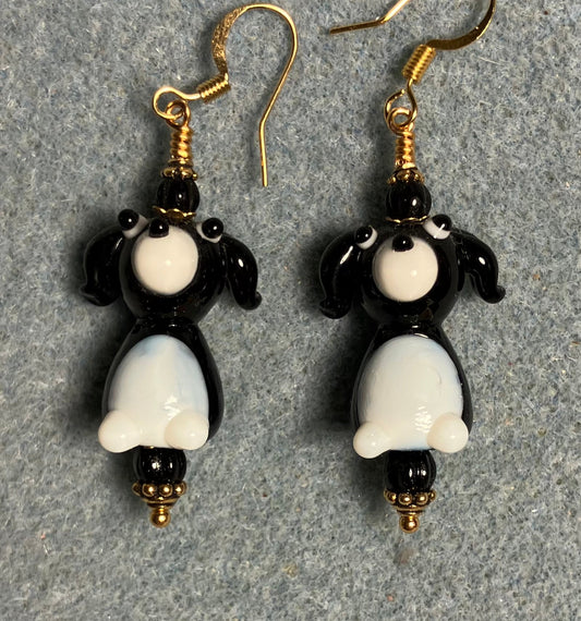 White and black lamp work puppy dog bead earrings adorned with black Czech glass beads.