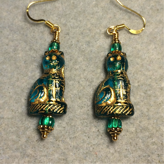 Translucent teal (with gold inlay) fancy Czech glass cat bead earrings adorned with teal Czech glass beads.
