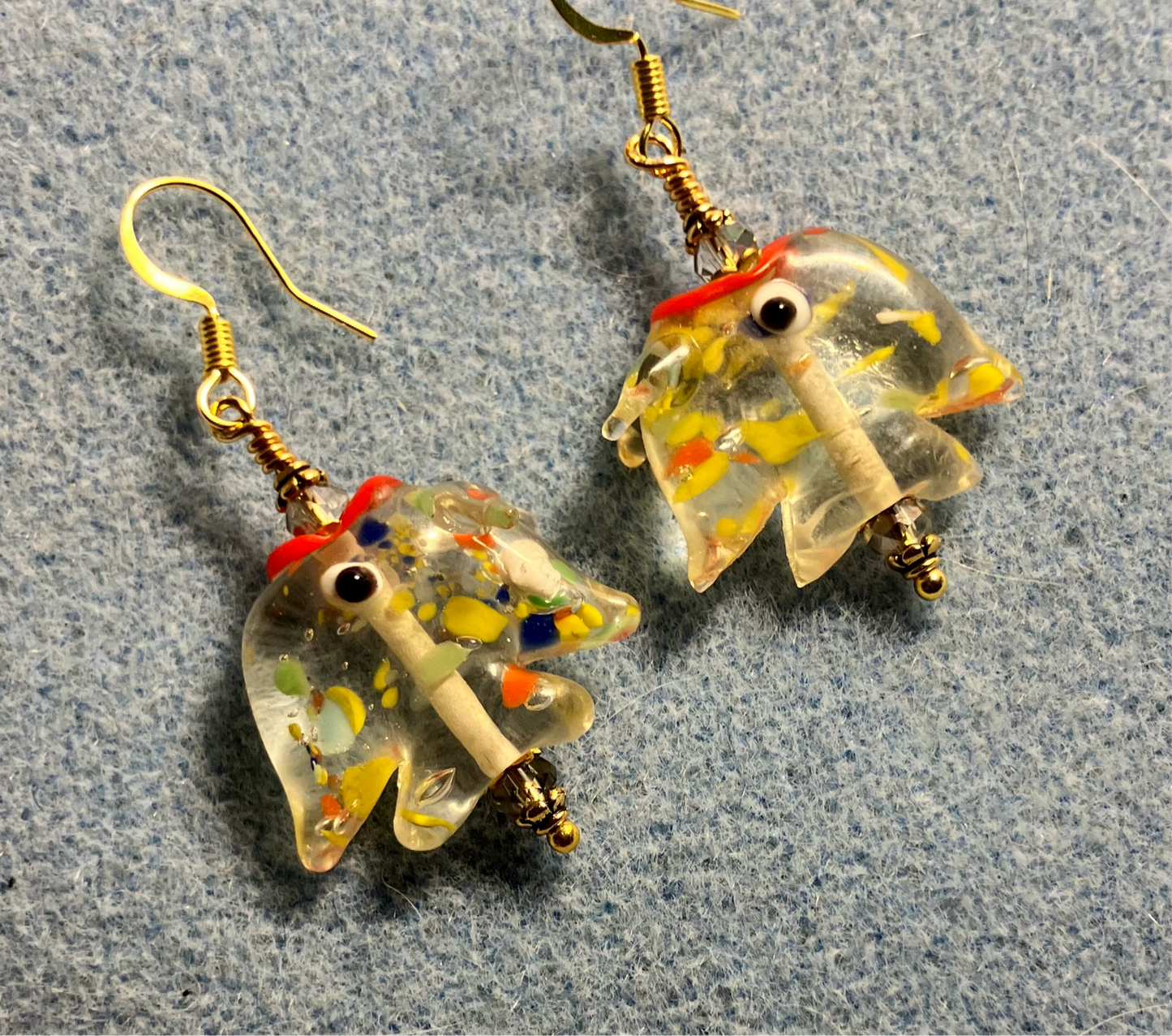 Transparent yellow and red lamp work spotted angelfish bead earrings adorned with clear Chinese crystal beads.