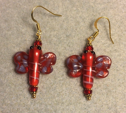 Red and purple lamp work dragonfly bead earrings adorned with red Chinese crystal beads.