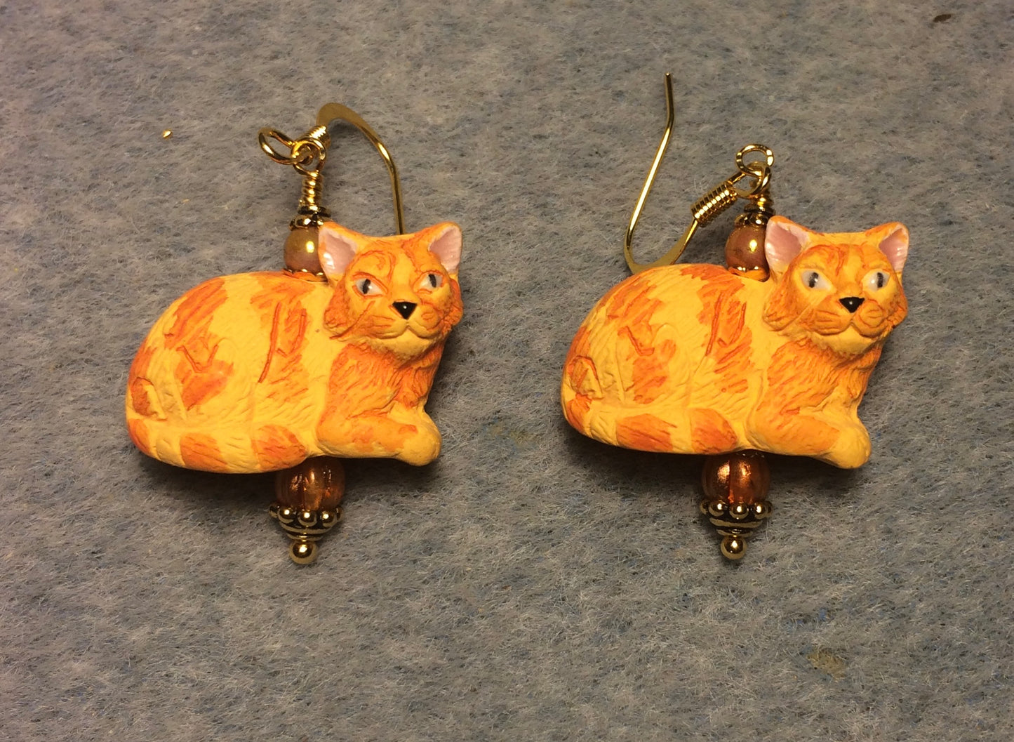 Orange striped ceramic tabby cat bead earrings adorned with orange Czech glass beads.