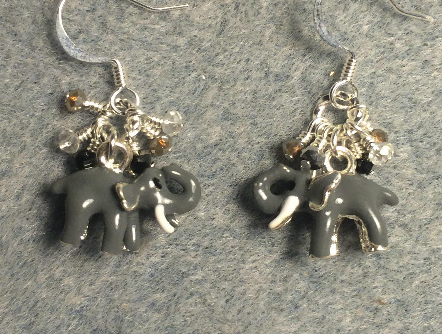 Small gray enamel elephant charm earrings adorned with tiny dangling gray, clear, and  black Chinese crystal beads.