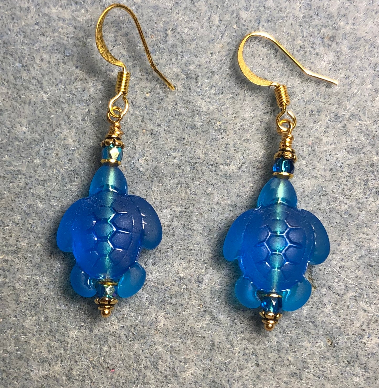 Blue turquoise sea glass sea turtle bead earrings adorned with turquoise Chinese crystal beads.