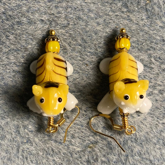 Yellow, black, and white lamp work striped tiger bead earrings adorned with golden yellow Czech glass beads.