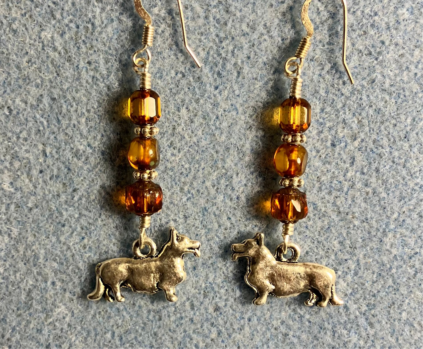Silver corgi charm earrings adorned with amber Czech glass beads