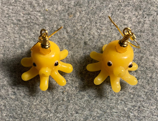 Yellow amber lamp work octopus bead earrings adorned with yellow amber Chinese crystal beads.