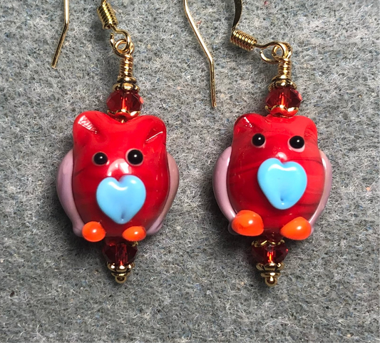 Opaque red and light blue lamp work owl bead earrings adorned with red Chinese crystal beads.
