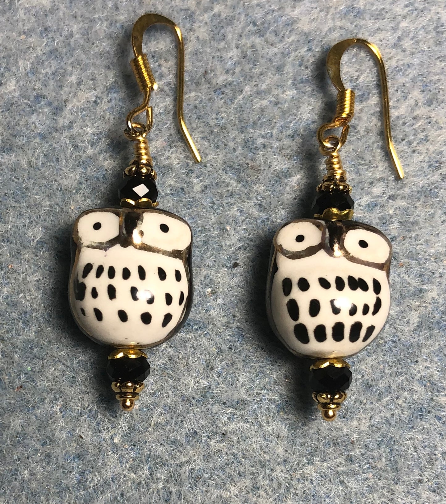 Black ceramic spotted owl bead earrings adorned with black Chinese crystal beads.