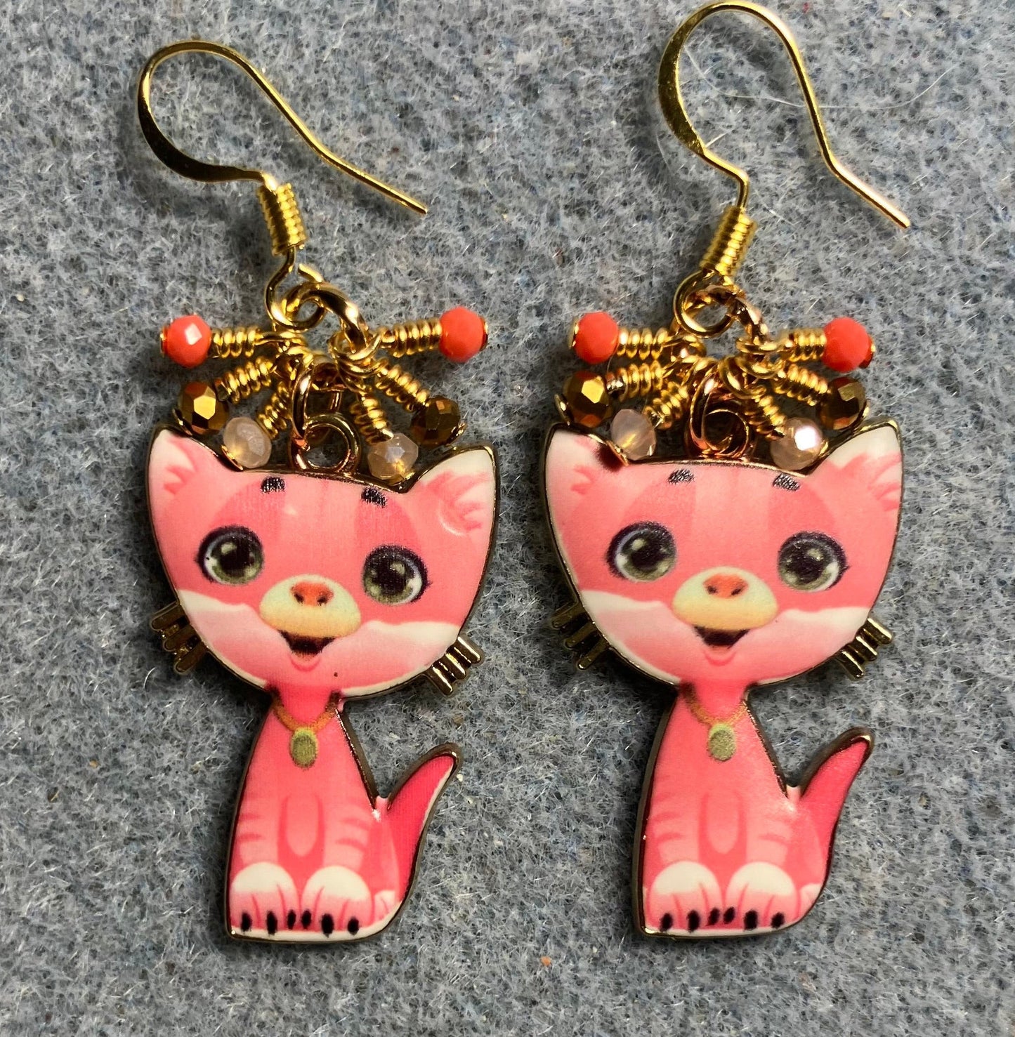Coral and peach enamel cat charm earrings adorned with tiny dangling coral, peach, and gold Chinese crystal beads.