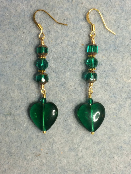 Emerald green Czech glass heart bead earrings adorned with emerald green Czech glass beads.