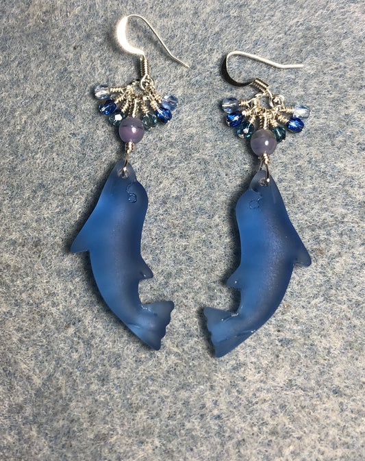 Blue sea glass dolphin pendant bead earrings adorned with blue Czech glass beads and tiny dangling blue Czech glass beads.