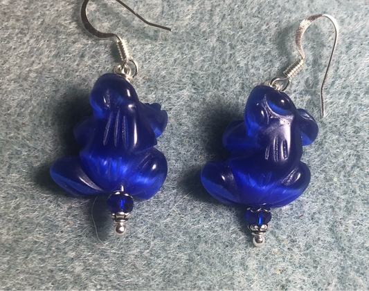 Dark blue fiber optic (cat’s eye) frog bead earrings adorned with dark blue Chinese crystal beads.