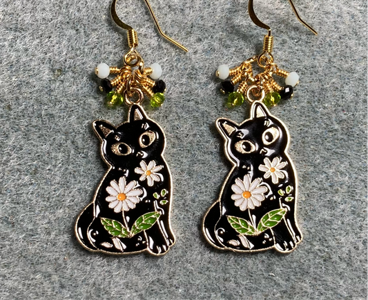 Black, olive green, and white enamel cat charm earrings adorned with tiny dangling black, olive green, and white Chinese crystal beads.