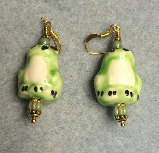 Green ceramic frog bead earrings adorned with green Czech glass beads.