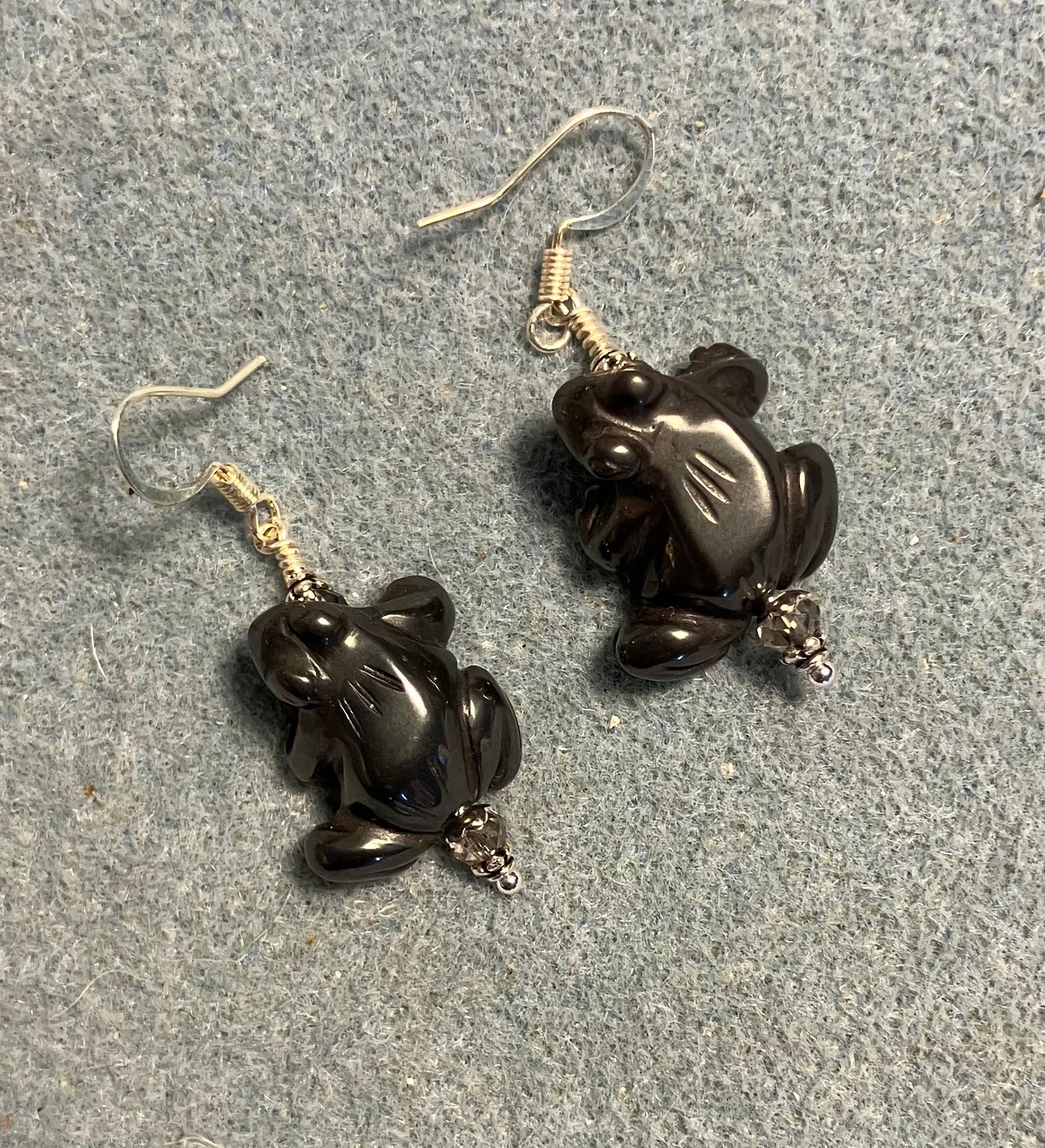 Gray hematite gemstone frog bead earrings adorned with gray Chinese crystal beads.