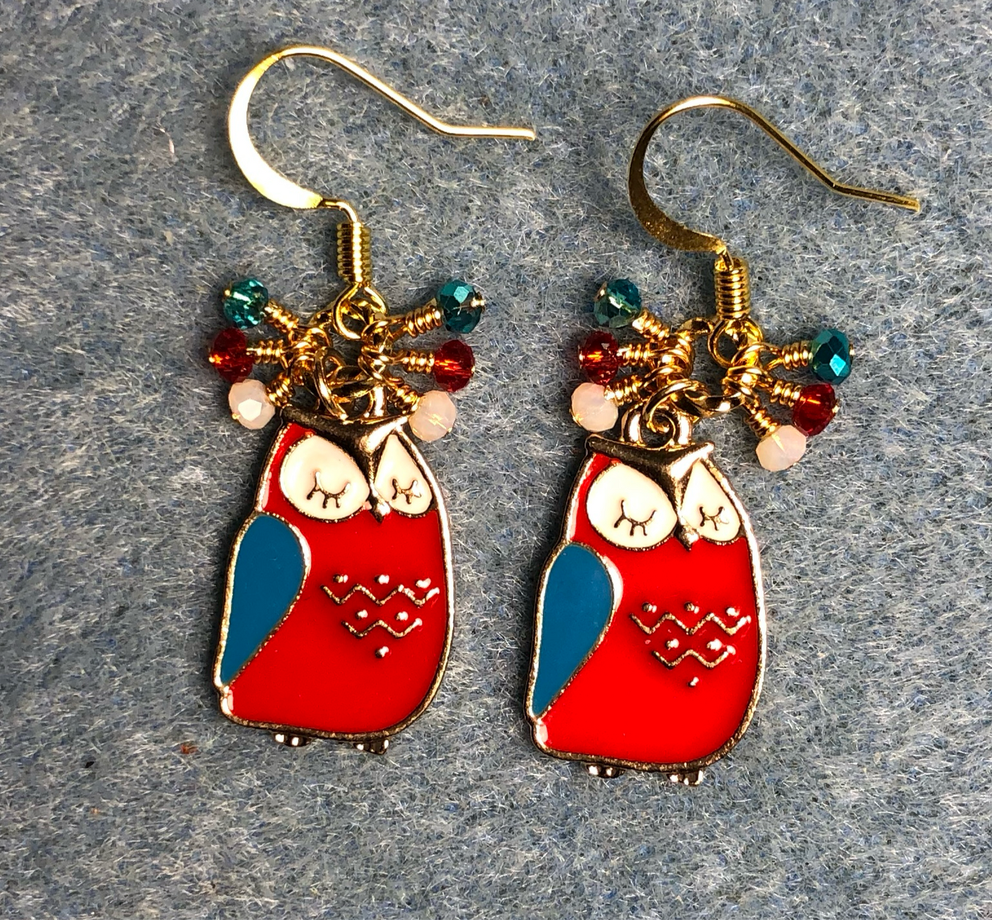 Red, turquoise, and white enamel sleepy owl charm earrings adorned with tiny dangling red, turquoise, and white Chinese crystal beads.