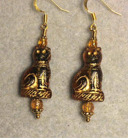 Translucent olive green amber (with gold inlay) fancy Czech glass cat bead earrings adorned with amber Czech glass beads.