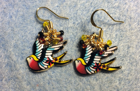 Red, black, and yellow enamel flying dove charm earrings adorned with tiny dangling red, black, and yellow Chinese crystal beads.