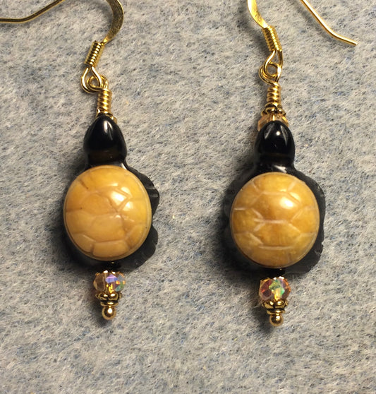 Black onyx and picture jasper gemstone turtle bead earrings adorned with amber Chinese crystal beads.