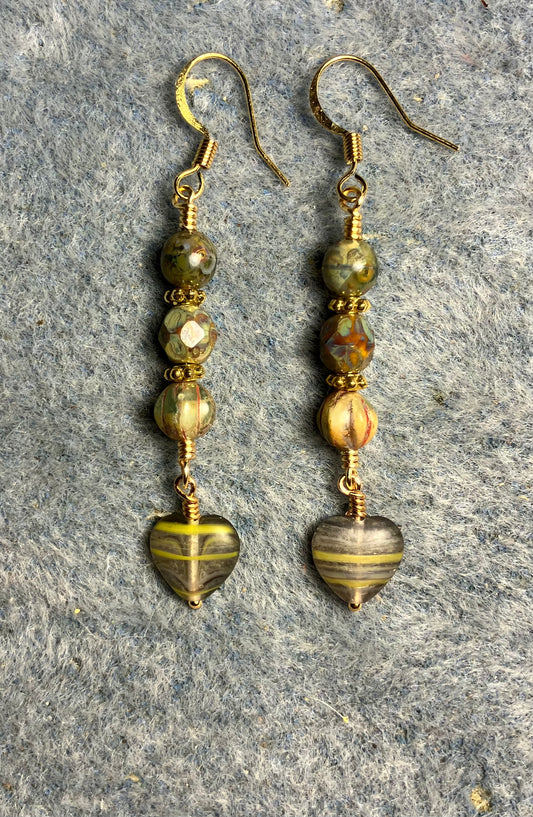 Small opaque green striped Czech glass heart bead earrings adorned with opaque green Picasso Czech glass beads.