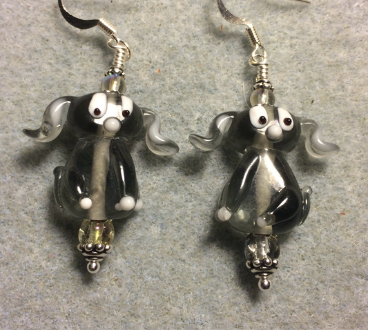 Translucent gray lamp work floppy eared puppy dog bead earrings adorned with clear Czech glass beads.