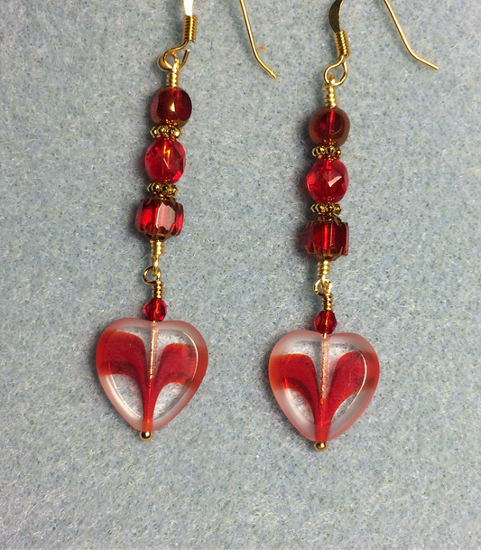 Red and clear Czech glass heart bead earrings adorned with red Czech glass beads.