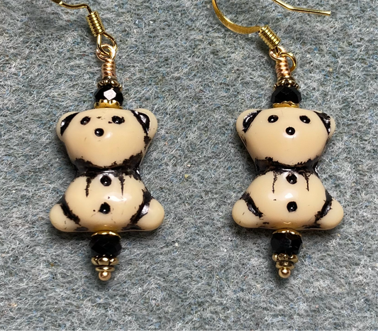 Opaque beige (with black inlay) Czech glass teddy bear bead earrings adorned with black Chinese crystal beads.