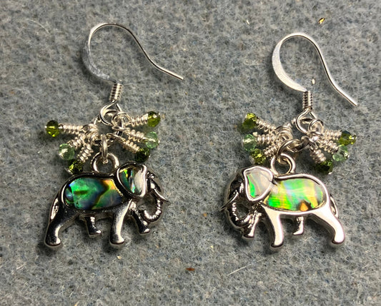 Small silver and abalone elephant charm earrings adorned with tiny dangling green Chinese crystal beads.