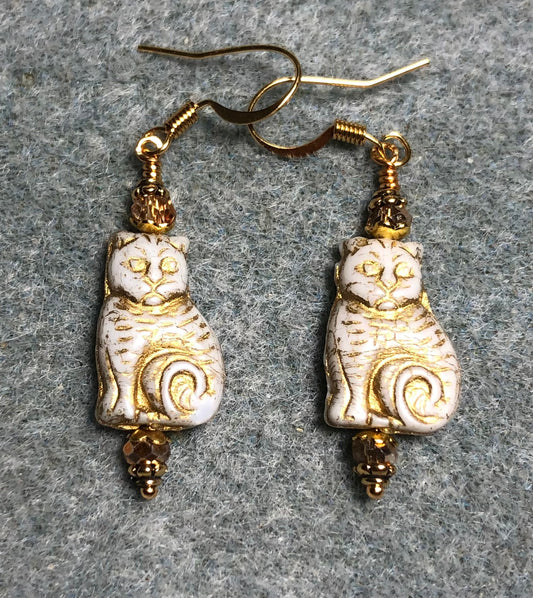 Medium white (with gold inlay) Czech glass cat bead earrings adorned with gold Chinese crystal beads.