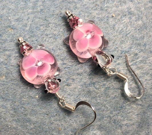 Pink lamp work turtle bead earrings adorned with pink Chinese crystal beads.