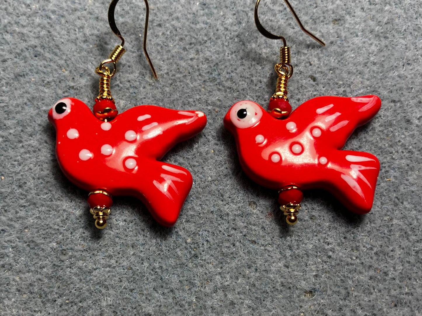 Large red ceramic flying dove bead earrings adorned with red Chinese crystal beads.