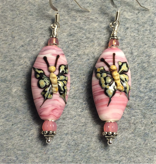 Pink and tan lamp work butterfly bead earrings adorned with pink Czech glass beads.