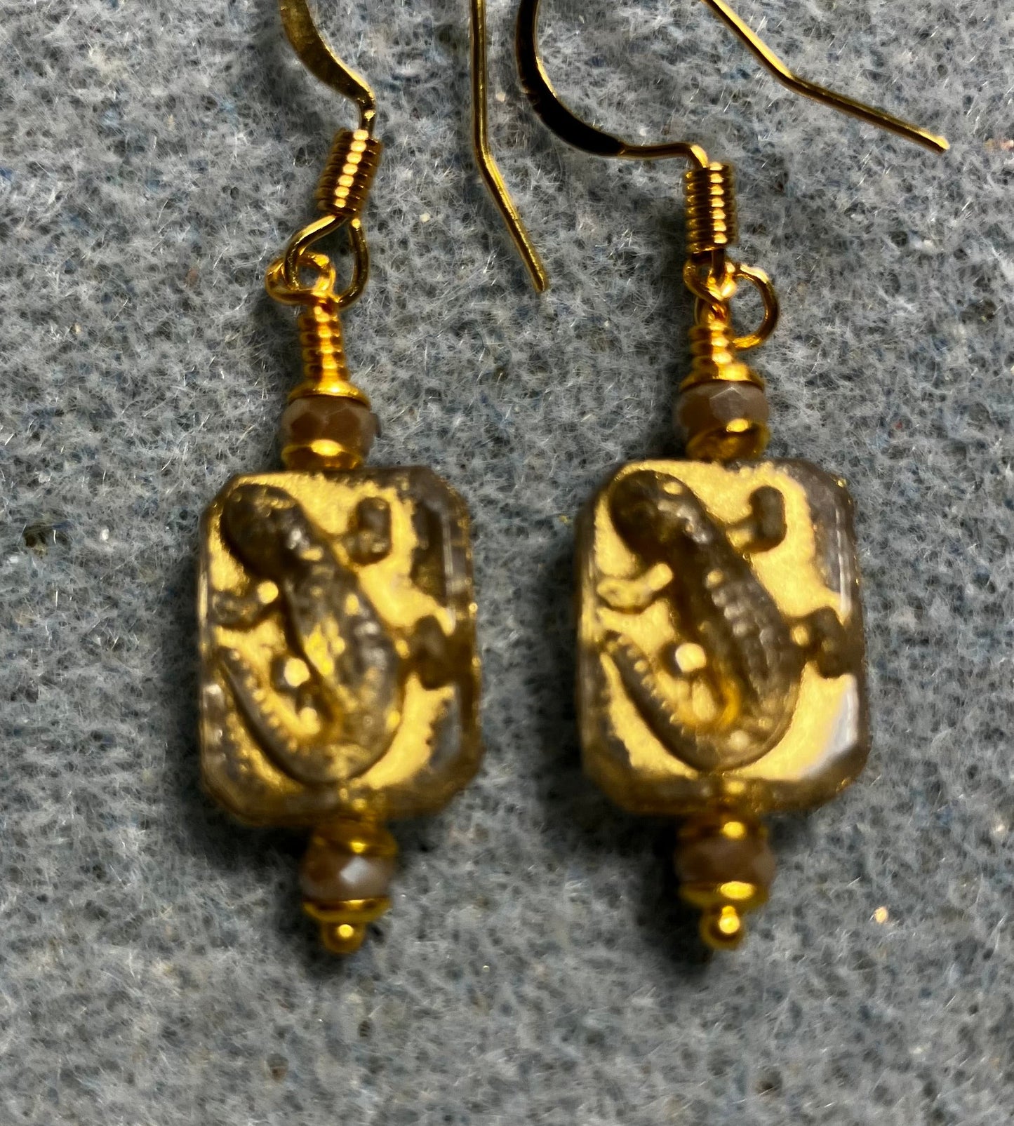 Small gray and gold Czech glass lizard bead earrings adorned with gray Chinese crystal beads.