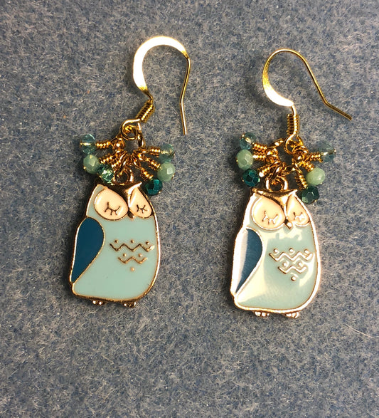 Aqua, turquoise, and white enamel sleepy owl charm earrings adorned with tiny dangling aqua and turquoise Chinese crystal beads.