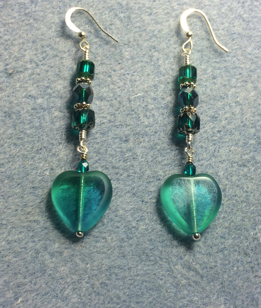 Teal Czech glass heart bead earrings adorned with teal Czech glass beads.