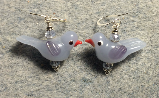 Milky light blue and lavender lamp work songbird bead earrings adorned with light blue Chinese crystal beads.