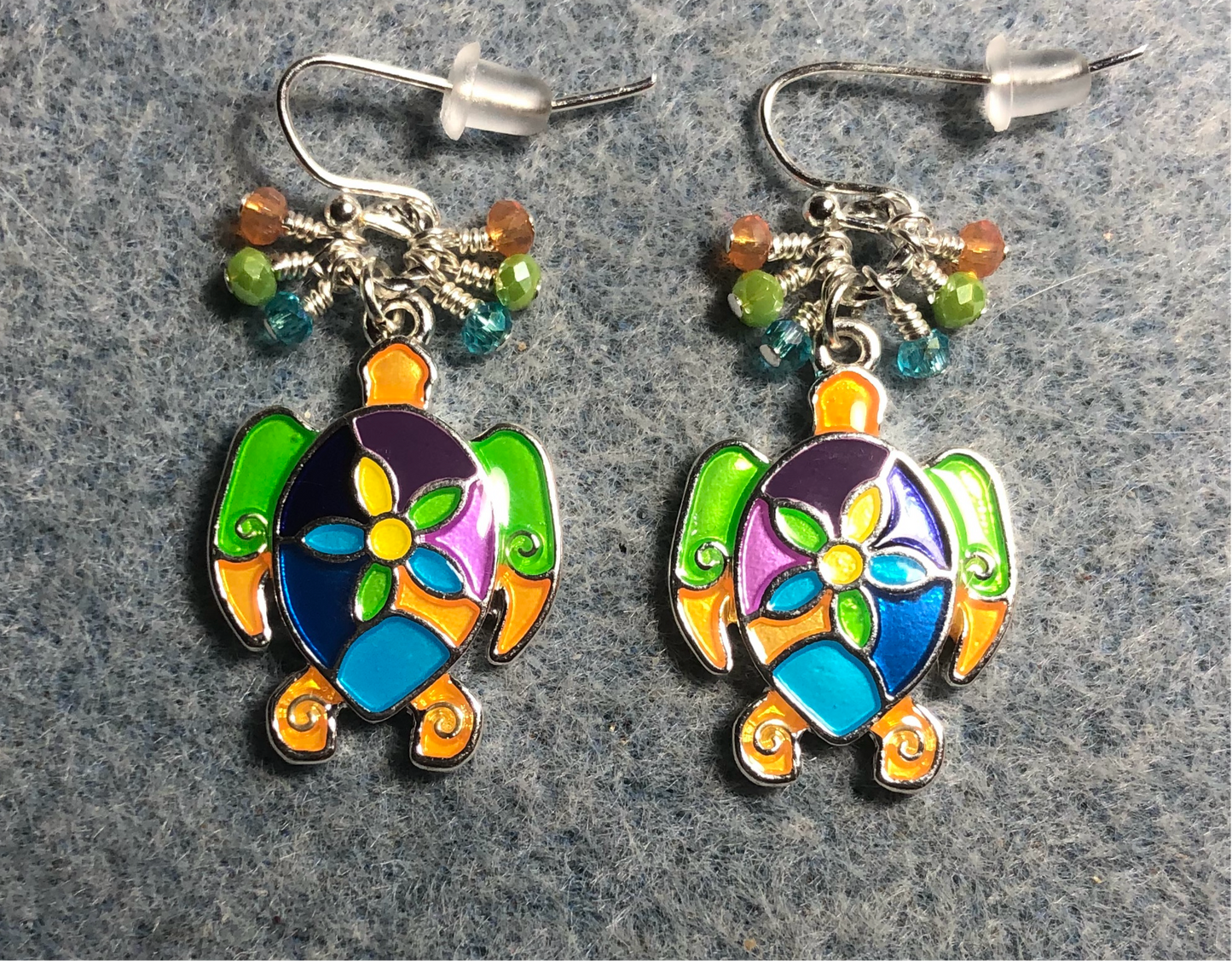 Colorful enamel sea turtle charm earrings adorned with small dangling turquoise, orange, and green Chinese crystal beads.