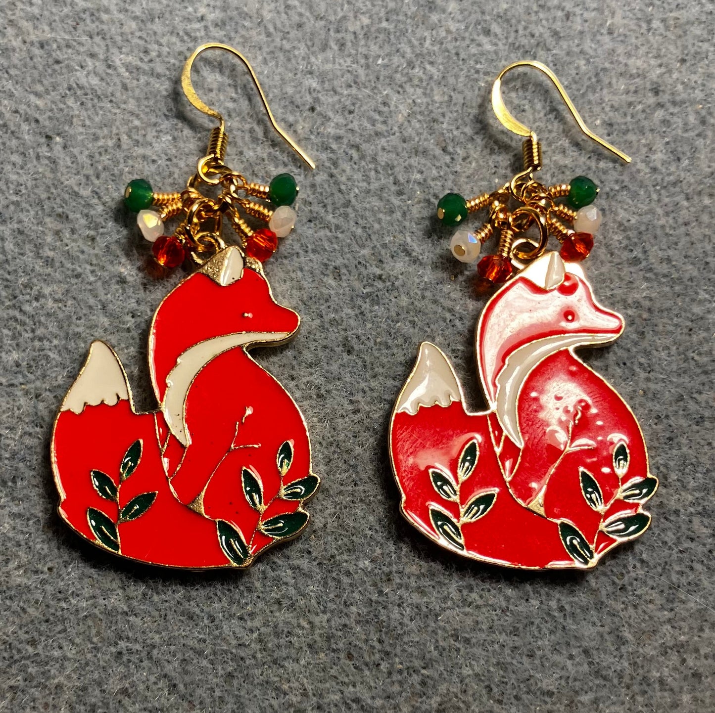 Red, white, and green enamel fox charm earrings adorned with tiny dangling red, white, and green Chinese crystal beads.