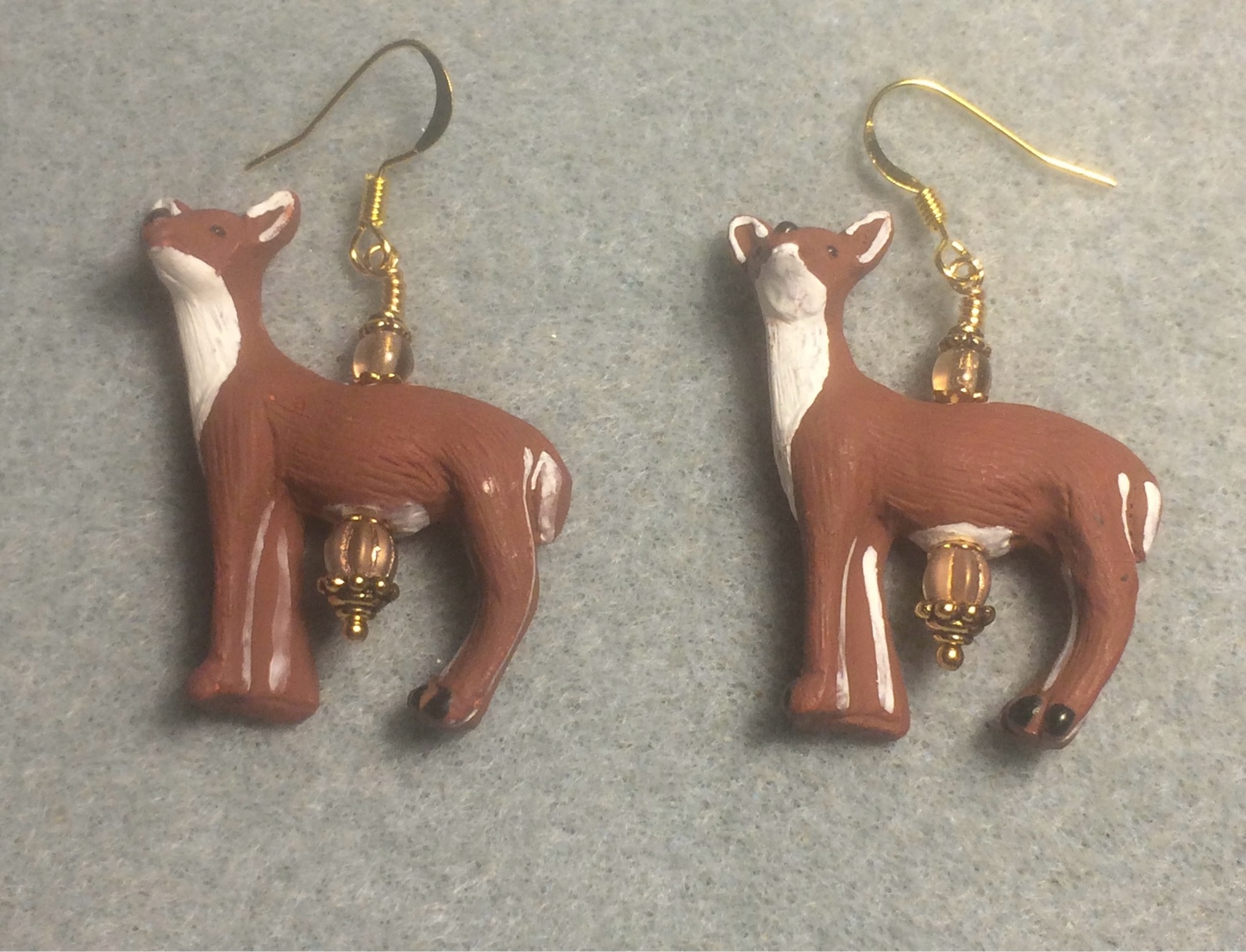 Large light brown and white ceramic deer bead earrings adorned with light brown Chinese crystal beads.