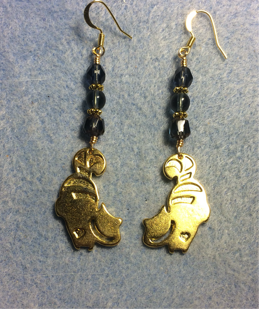 Gold Cheshire cat charm earrings adorned with Montana blue Czech glass beads
